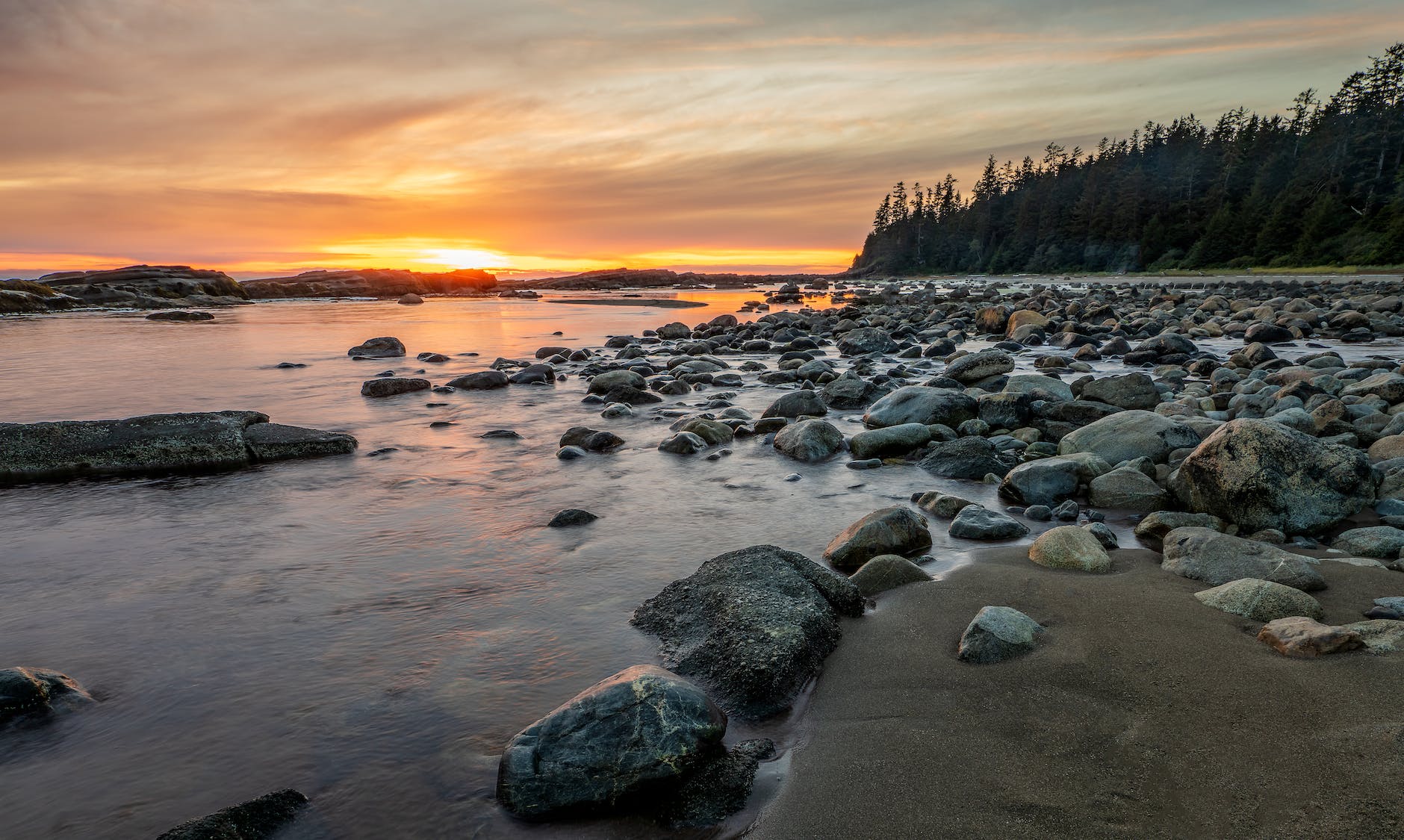 rocky shore with rocks on the shore during sunset