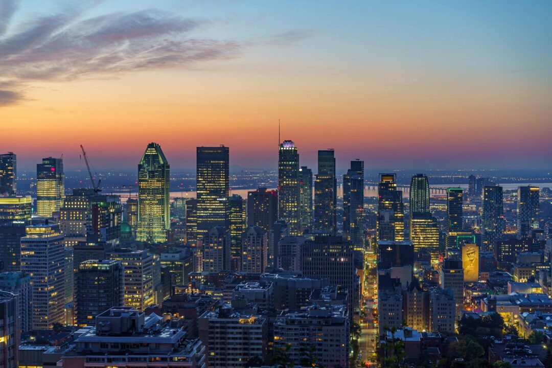 skyscrapers in city at sunset